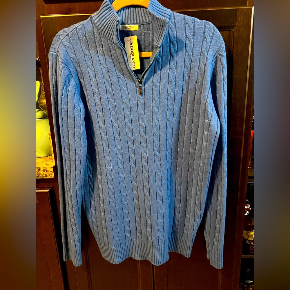 Men’s long sleeve 1/4 zip sweater.